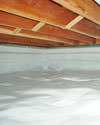 a moisture barrier installed on the walls and floors of a crawl space in Marion