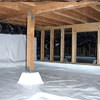 A large, encapsulated crawl space with our vapor barrier system installed in Dubuque.