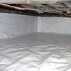 A crawl space vapor barrier has been installed on the walls and floors of this space in Clinton.