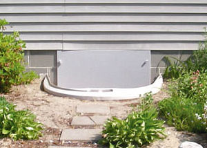 Rigid plastic crawl space access well installed in a Davenport crawl space