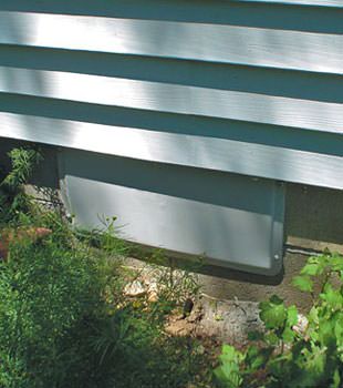 A gray crawl space vent cover in Freeport