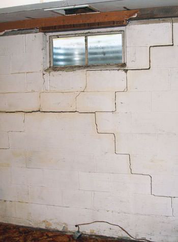 severe bowing and buckling of foundation walls in Clinton