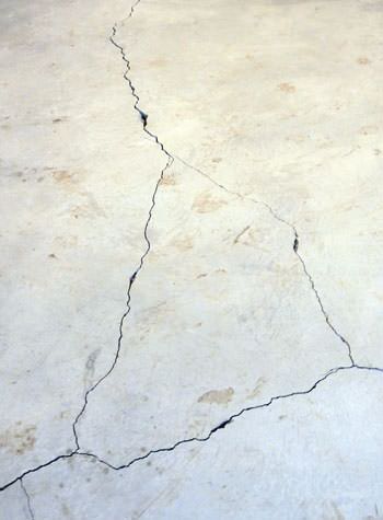 severely cracked, heaving slab floors in a home in La Salle
