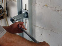 Mounting a foundation wall channel anchor in Dubuque.