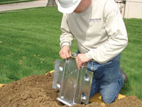 Fastening an earth anchor for a severely bowing wall in Normal.