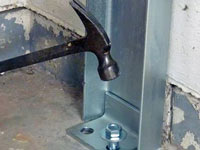 Mounting a foundation channel anchor installation to the floor in Dubuque.