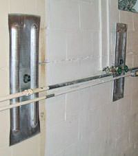 A foundation wall anchor system used to repair a basement wall in Coralville