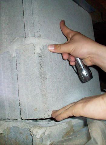 a completely failing concrete crawl space support pillar in Evansdale