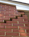 Serious damage to a foundation wall due to settlement of a home in East Moline