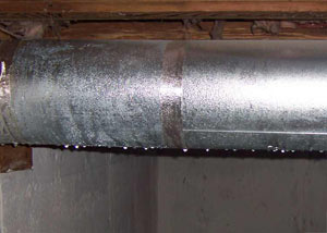 condensation collecting on an HVAC vent in a humid Pekin basement