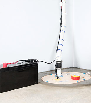 A sump pump installed in Pekin by Mid America Basement Systems