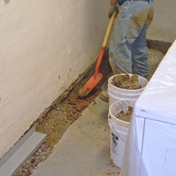 Digging a trench for a French Drain system in Cedar Rapids