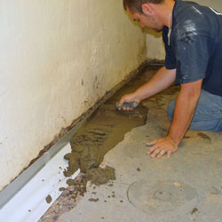 Testing a French drain system in a Rock Island home.